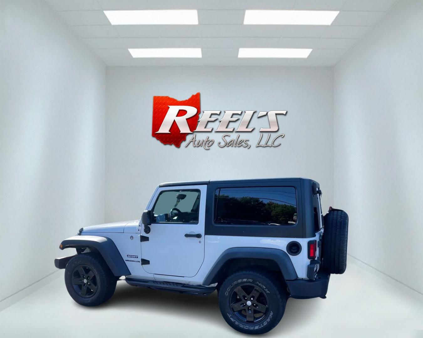 2013 White /Black Jeep Wrangler Sport 4WD (1C4AJWAG7DL) with an 3.6L V6 DOHC 24V engine, 6 Speed Manual transmission, located at 11115 Chardon Rd. , Chardon, OH, 44024, (440) 214-9705, 41.580246, -81.241943 - Photo#11